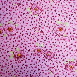 Schöner Badelycra Stoff in rosa mit Blumenmuster, die von einer gewissen Entfernung wie Stickerei wirken. Perfekt für Badeanzüge, Bikinis oder Tankinis.