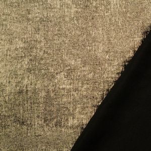 Glänzender goldfarbiger Metallic-Stoff, weich fallend, mit schimmernder Oberfläche und sichtbarer schwarzer Rückseite. Ideal für glamouröse Tops & Kleider.