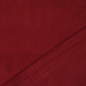 Nahaufnahme der Fleece dunkelrot Heavyweight Textur. Warmer, besonders dichter Stoff mit guter Isolation und weicher Oberfläche.