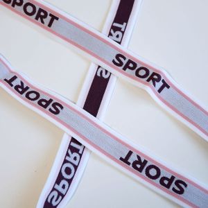 Unterhosengummi in taupe-rosa-weiss mit der Aufschrift 'Sport' für Unterwäsche und Trainingshosen in 5m-Packung.