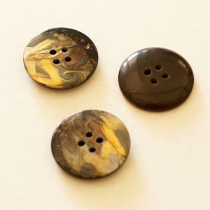 Dunkler Knopf mit gold-Marmor Musterung
