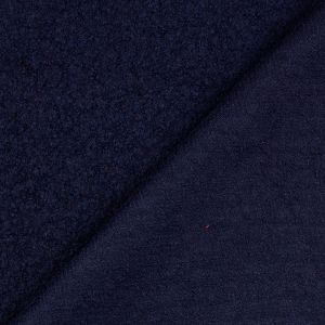 Woll-Bouclé Stoff in der Farbe dunkelblau, mit Ansicht der strukturierten Vorderseite und der gleichfarbigen, glatteren Rückseite.